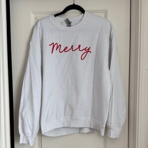 White Sweatshirt with Red 'Merry' Text